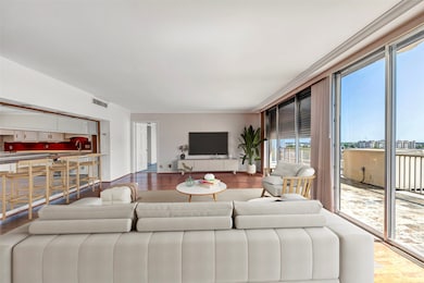 Bright and airy living room featuring expansive sl