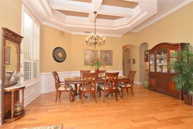 Dining room w/ tray ceilings that are also crown m