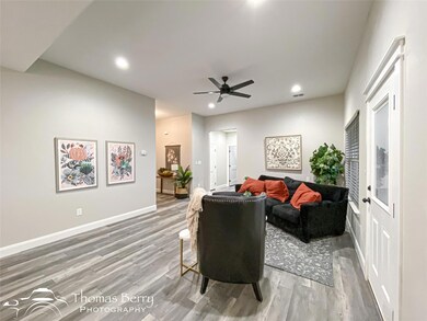 Living room featuring wood-type flooring and ceili
