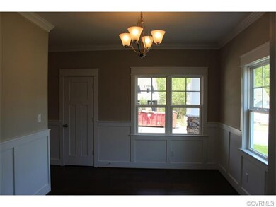 Dining Room with Crown Moulding and Wainscoting