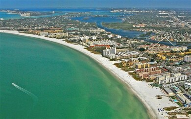 Aerial view showing building location to beach acc