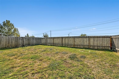 View of fenced backyard