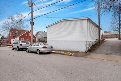 Street view from side of garage/driveway looking a