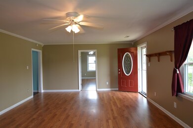 Step into this beautiful farmhouse living room with hardwood floors and a fireplace.