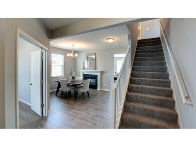 As you enter this spacious home, the stairway welc