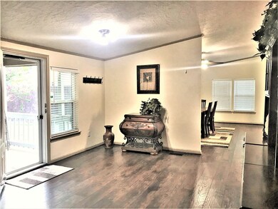 From the front door with clear patio door, you arrive at this spacious entry with the dining & kitchen areas immediately to the left.