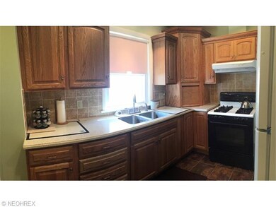 Thomasville cabinets and quite close draws, newer vinyl window, and vinyl floor.