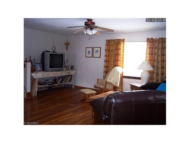 Living room with another view of hardwood floors