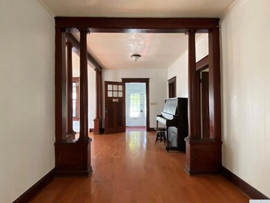View from Dining looking toward front Entry Room a