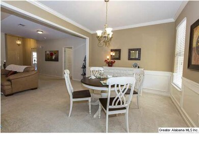 Beautiful Dining Room with crown molding, and big 