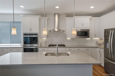 gourmet kitchen, quartz countertops and long island! laminate plank floor
