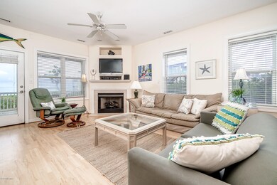 Open concept living area w/ fireplace