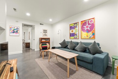 Living room with concrete floors and recessed lig