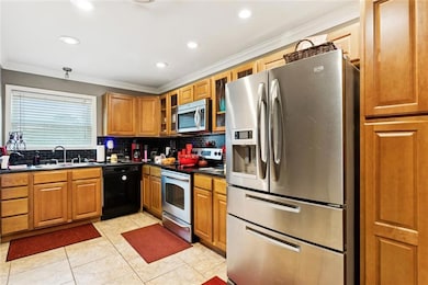 Kitchen with many cabinets.  Stainless Steel appli