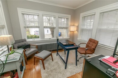 The sun room is awash in natural light and is the perfect spot for a home office.