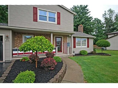 Exterior Front. Attractive gardens decorate the wa