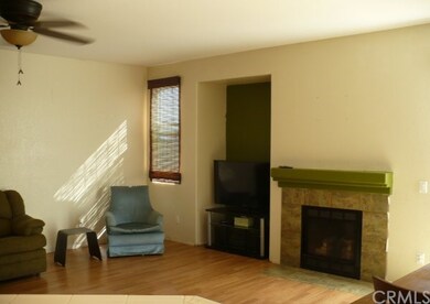 Nice sized living room with fireplace, great floor