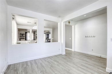 Unfurnished room with wood finished floors