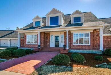 Covered front porch and full brick exterior.