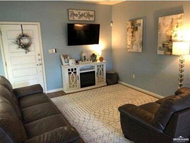 Living area featuring baseboards and wood finished floors