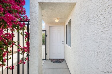 Doorway to property with stucco siding