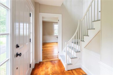 Front stairway leading to three...