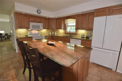 Kitchen with granite counters, ceramic floor and s