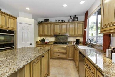 Slab granite counters and stainless appliances mak