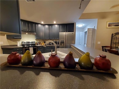 Kitchen with sink and appliances with stainless st
