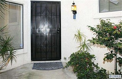 front door area with planters, watch out for hummi