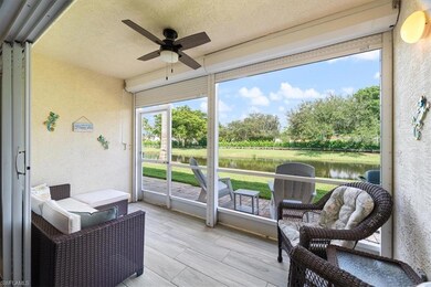 Sunroom with a water view and a ceiling fan