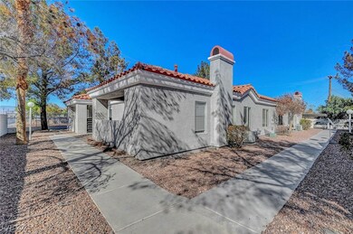 View of property exterior with stucco siding, a ti