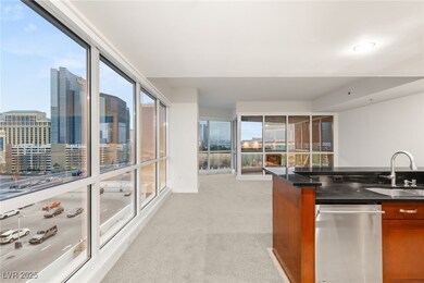 Kitchen with a sink, light carpet, brown cabinets,