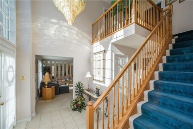 This reverse view into the foyer shows the stairs 