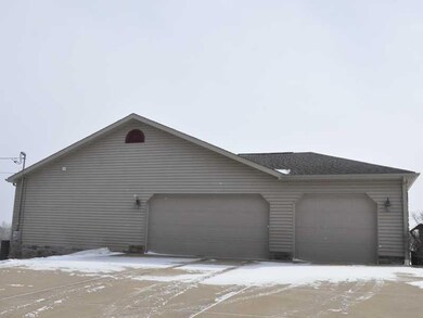 Parking Lot/Garage. Plenty of parking, and a 3 car