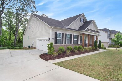 Welcome Home to 8421 Bramfield Dr. Side Entry garage and rocking chair front porch with cedar columns!