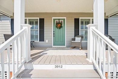 View of exterior entry featuring a porch