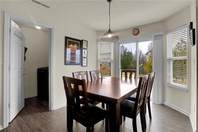 The conveniently located laundry room offers extra storage off the kitchen