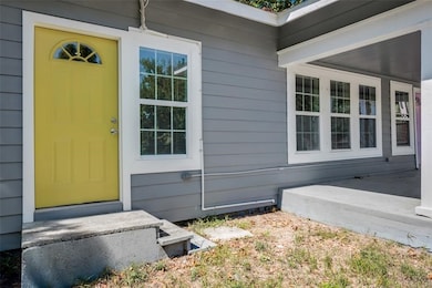 Unit D stands out with this lovely yellow door