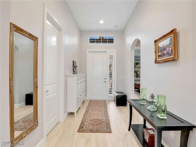 Foyer entrance with light wood-type flooring