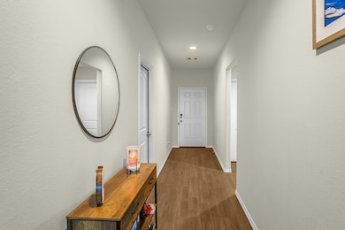 Long foyer opens up into the living area which features high ceilings!