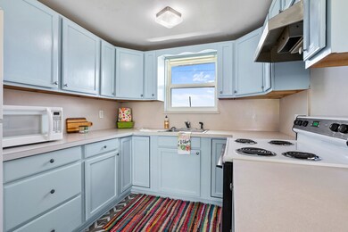 The kitchen has a great layout with tons of cabine