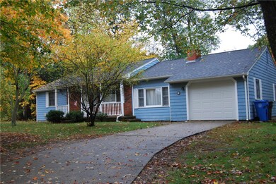 Some brick front with a porch and a one car garage