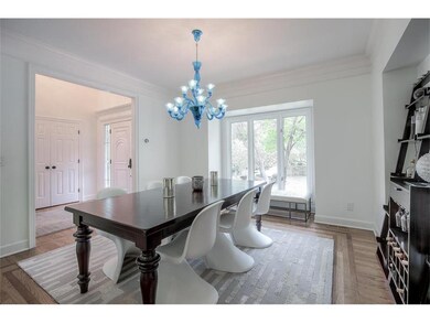 Dining room with unique custom chandelier with bum