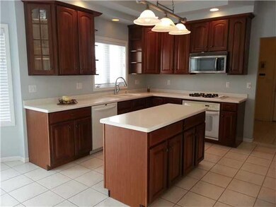 Exterior Front. Cherry cabinets with solid surface