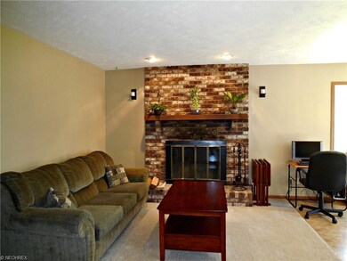 Hearth Room is located directly off the kitchen, w