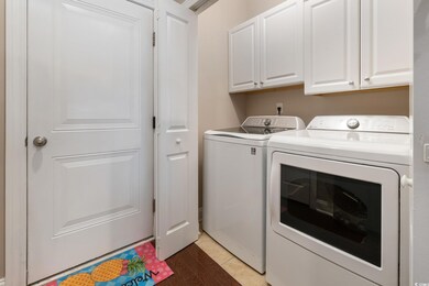 Laundry area with cabinets and washing machine and dryer