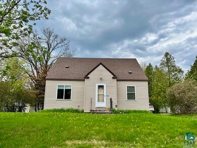Back of property with a yard