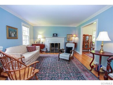 The gracious living room has hardwood flooring, cr
