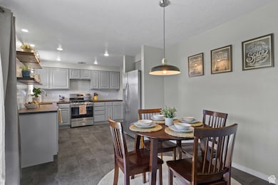 Dining area featuring baseboards and recessed lighting